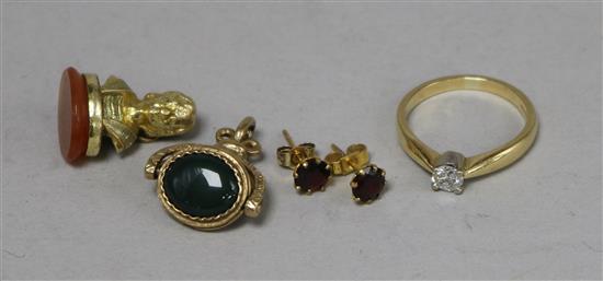 An 18ct gold and solitaire diamond ring, a 9ct gold spinning fob, a pair of 9ct gold ear studs and a gilt metal seal.